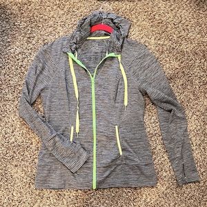 Striped grey athletic jacket with green accents